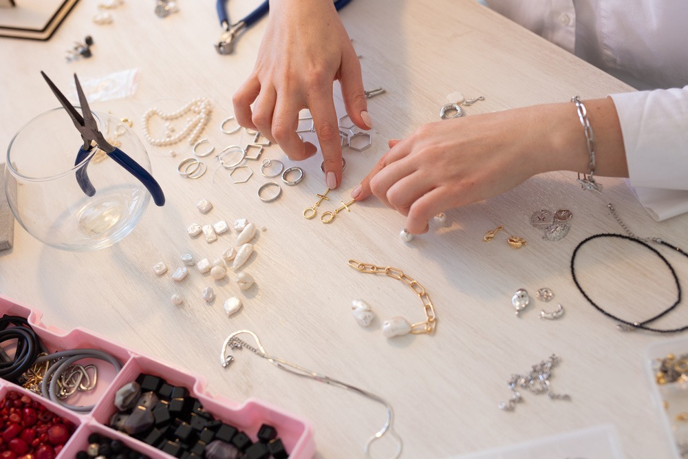 Artisan at Lumia Luxe meticulously crafting fine jewelry with precision tools